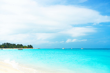 Panoramic view of a beautiful sunny day on sandy beach on exotic island.