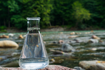 Glass flask with clean drinking water.