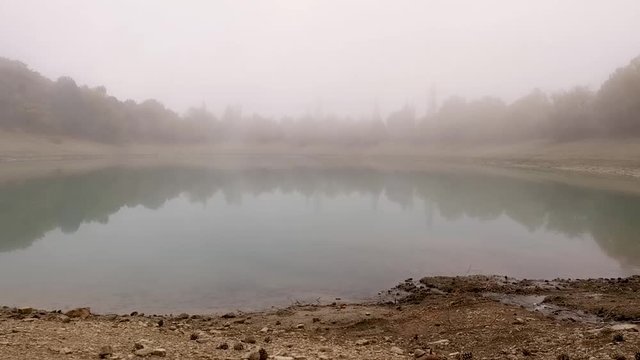 Time lapse motion of the fog over the lake
