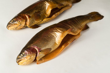 Cold smoked rainbow trout on a white background