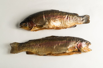 Cold smoked rainbow trout on a white background