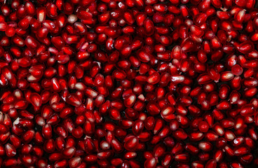 Macro of peeled ripe seeds pomegranate isolated