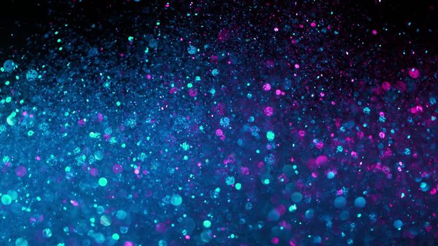 Super Slow Motion Shot of Neon Glitter Background at 1000fps.