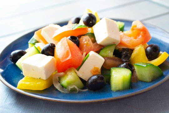 Greek salad with feta cheese and sun-dried olives, bright image