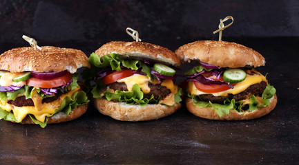 Tasty fresh meat burgers with salad and cheese. Homemade angus burger.