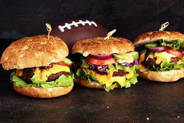 Tasty fresh meat burgers with salad and cheese. Homemade angus burger. Great for Bowl football Game...