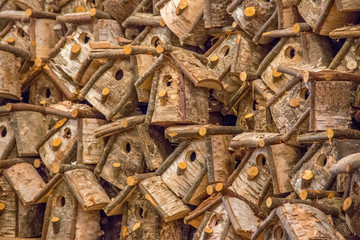 Pile of wooden bird houses