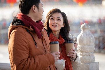 Happy young couple dating outdoors in winter