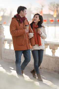 Happy young couple dating outdoors in winter