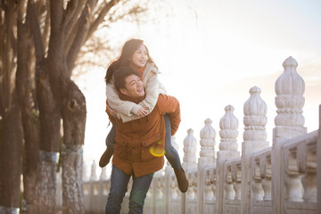 Happy young couple dating outdoors in winter