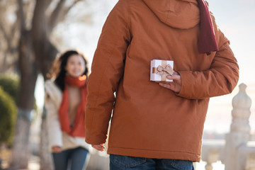 Happy young couple dating outdoors in winter