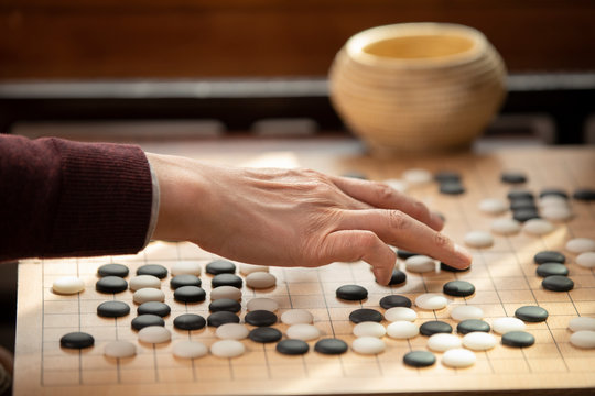 Senior man playing the game of go