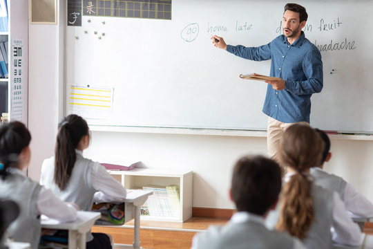 Young teacher teaching a class