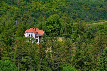 Fototapeta na wymiar View on the lonely house in the forest - Svaty Jan pod Skalou - Czech republic