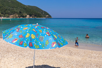 Family of african ethnicity enjoying the beach in Lefkada, Greece