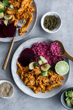 Plates with red quinoa and chicken curry