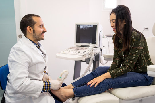Podiatry doctor using ultrasound scanner