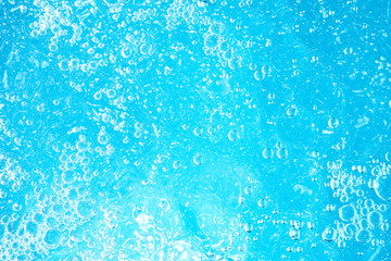 Underwater Near Ocean Surface with Rising Bubbles in Blue Sea