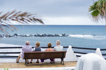 Senior tourists  looking at the sea.  Canary Islands, Tenerife.