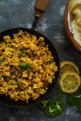 Scrambled eggs/ Masala egg Bhurji served with roti, selective focus