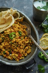 Scrambled eggs/ Masala egg Bhurji served with roti, selective focus
