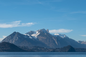 View of Lake Thun near the town of Spietz, Interlaken, Switzerland, photographed on a clear day whilst on a boat tour of the lake in mid winter.