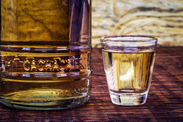 Detail of a bottle of cachaça, a typical Brazilian drink. Brazilian product for export, distilled drink known as aguardente or pinga. Day of cachaça.