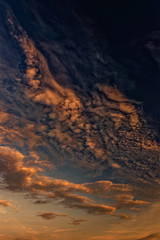 Fototapeta na wymiar Magnificent altostratus cloud in magenta colors at sunset.