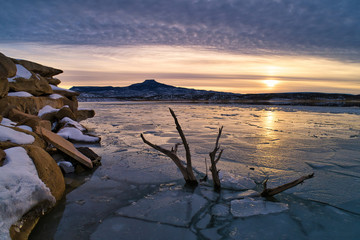 Winter Sunset at Lake Abiquiu in New Mexico with the famous Cerro Pedernal in the Background