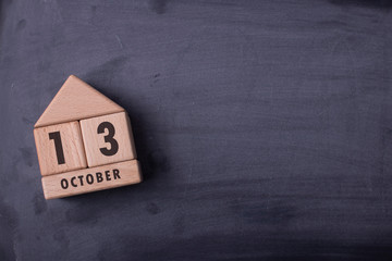 October 13 written with wooden blocks