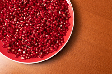Pomegranate seeds in plate 