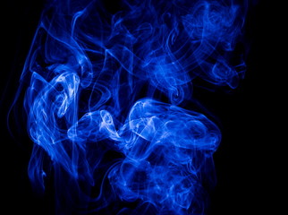 Blue smoke on black background