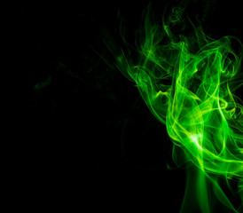 Green smoke on black background