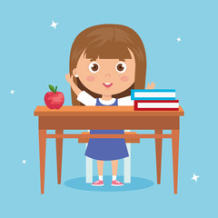 student girl sitting in school desk, back to school