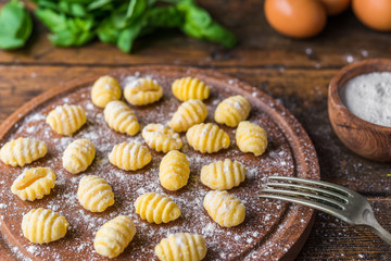Fototapeta na wymiar Making gnocchi, traditional Italian pasta food made of potatoes and flour