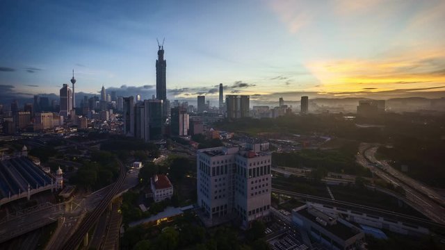 4k time lapse of sunrise at Kuala Lumpur city horizon, aerial view. 