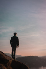 man on top of mountain