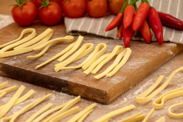 Fresh homemade pasta Scialatielli with ingredients on the table