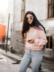 Beautiful model posing for the camera on the streets.