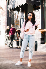 Beautiful model posing for the camera on the streets.
