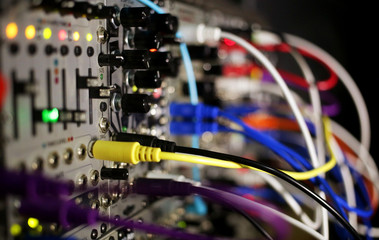 modular synthesizer in producer recording studio  