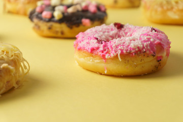 doughnuts on yellow surface. close up. selective focus