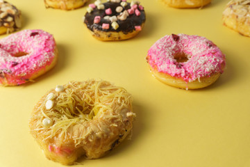 doughnuts on yellow surface. close up. selective focus