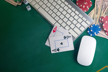 Poker online, casino, online gaming business. Chips, cards money and pc. Background for online gaming business.