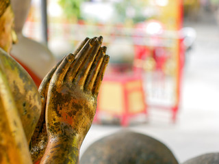 Close up praying hands of Buddha. Praying hands golden of Buddha.
