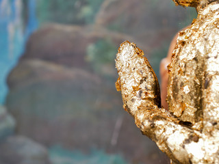 Close up praying hands of Buddha. Praying hands golden of Buddha.