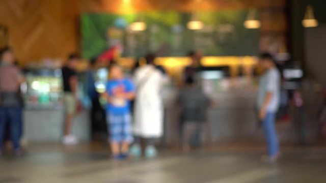 People walking in front of the coffee shop ,Abstract Blurred background
