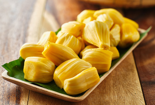 pile of peeled jackfruit on banana leaf serving tray,
