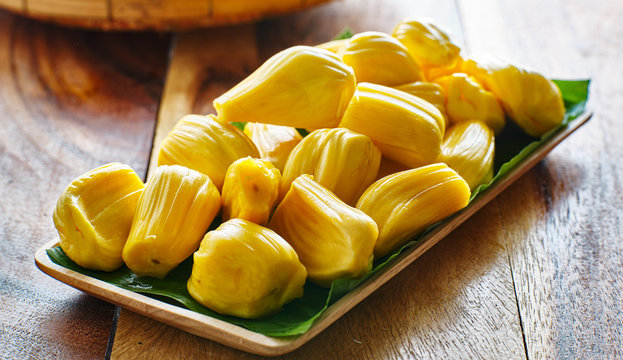 pile of peeled jackfruit on banana leaf serving tray,