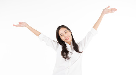 Portrait of an asian young beautiful woman with long curly black hair smiling brightly with two hands in the air, isolated on white background. For concept of celebration, cheering, success, business.